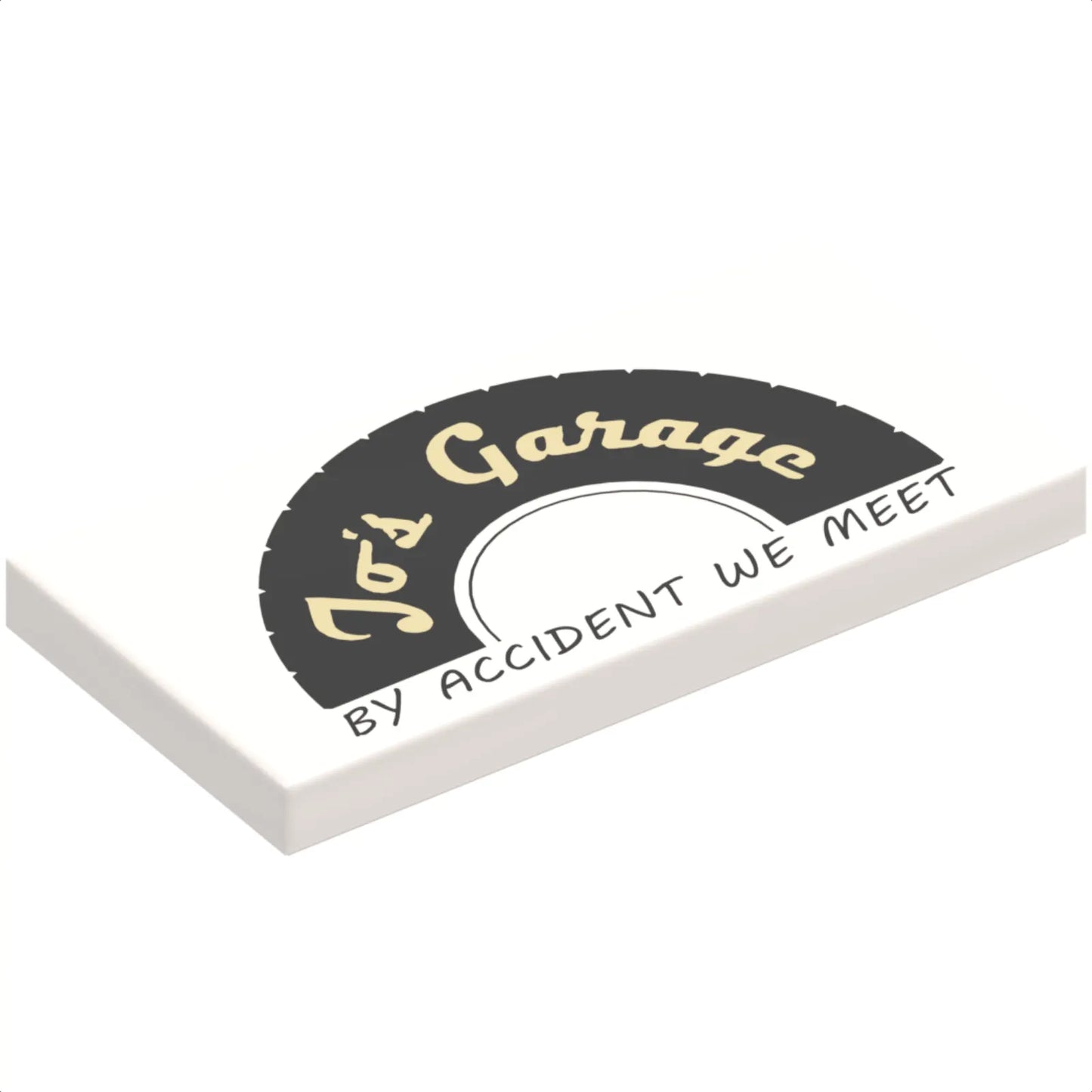 Part 87079pb0545 - Tile 2 x 4 with Black Tire Half with Tan 'Jo's Garage' and Black 'BY ACCIDENT WE MEET' Pattern