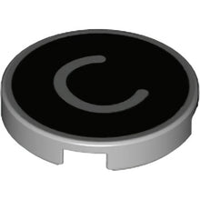 Part 14769pb424 - Tile, Round 2 x 2 with Bottom Stud Holder with Silver Capital Letter C on Black Background Pattern