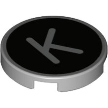 Part 14769pb432 - Tile, Round 2 x 2 with Bottom Stud Holder with Silver Capital Letter K on Black Background Pattern
