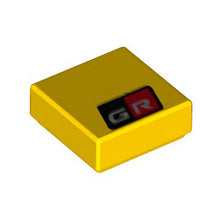 Part 3070pb220 - Tile 1 x 1 with Silver 'GR' on Black and Red Background Pattern