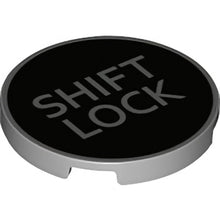 Part 67095pb010 - Tile, Round 3 x 3 with Silver 'SHIFT LOCK' on Black Background Pattern