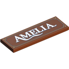 Part 69729pb164 - Tile 2 x 6 with Sign with White 'AMELIA' and Dark Blue and Gold Border Pattern