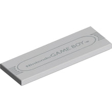 Part 69729pb203 - Tile 2 x 6 with Light Bluish Gray 'Nintendo GAME BOY' and Oval Outline Pattern