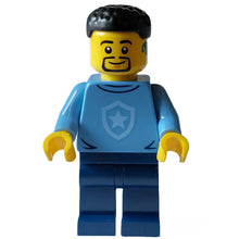 Minifig cty1563 - Police - City Officer in Training Male, Medium Blue Shirt with Badge, Dark Blue Legs, Black Short Hair, Beard, Hearing Aid